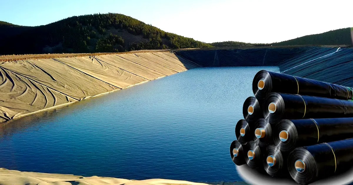 Geomembrane lining on a dam reservoir slope with stacked geotextile rolls