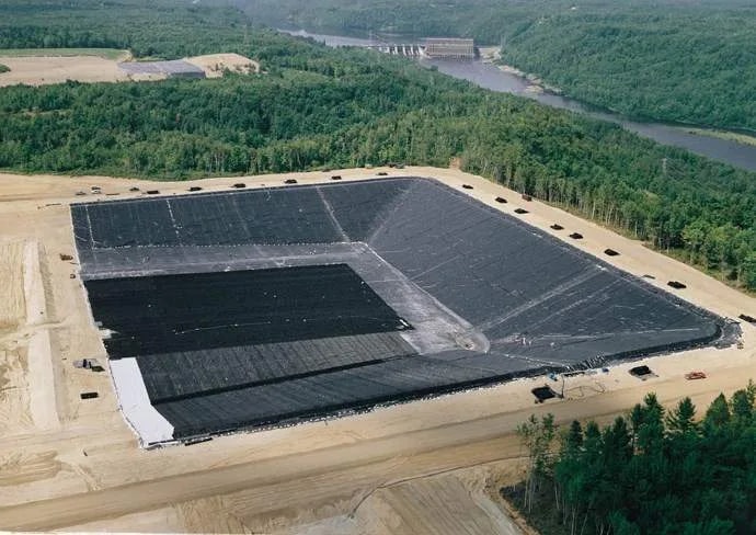 Aerial view: containment pond lined with smooth HDPE geomembrane